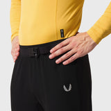 LYCRA® ADAPTIV Baselayer Longsleeve in amber yellow worn with black shorts, waist detail