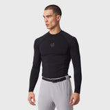 LYCRA® ADAPTIV Baselayer Longsleeve in black, worn by model in side profile pose