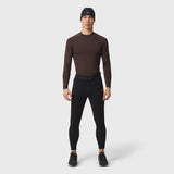 LYCRA® ADAPTIV Baselayer Longsleeve in dark brown, worn with black leggings, front view