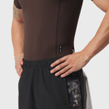 LYCRA® ADAPTIV baselayer shortsleeve in dark earth, worn by model, side view