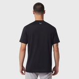 Black short-sleeve polo shirt worn by model, back view