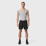 LYCRA® ADAPTIV Baselayer Tank in slate grey, worn with black shorts, front view on model