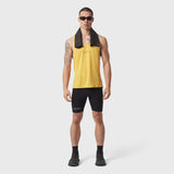 Polartec® Delta Singlet in amber yellow worn by male model with black shorts and towel