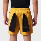 Tetra-Lite Adventure Short in amber yellow with black side panels, worn by model from behind