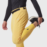 Hybrid Belt-Pack Run Jogger in amber yellow worn by model, side view with belt detail
