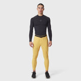 Hybrid Belt-Pack Run Jogger in amber yellow with black long-sleeve compression top, front view on model