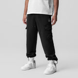 Deltapeak® Cargo Cinch Jogger in black worn by model with white sneakers, front view