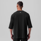 Black Supima® 3/4-sleeve oversized tee on model, back view