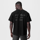 Black Tech Essential Relaxed Tee with 'OTWR' graphic, back view on model
