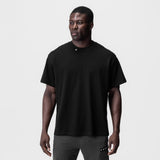 Tech Essential Relaxed Tee in black, worn by model, front view