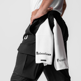 Black Tetra-Lite® Cargo High Rib Jogger with white towel detail, model holding product