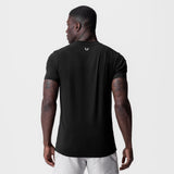 Black Supima Essential Tee worn by model, back view