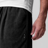 Towel Terry Relaxed Short in black, worn by model showing side detail and fit