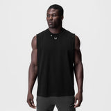 Black Tech Essential Relaxed Cutoff tank top on model, front view