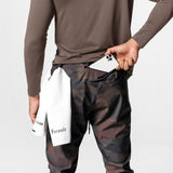 Tetra-Lite High Rib Jogger in rust camo worn by model, holding phone and white towel