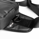 Flatlay water resistant small crossbody bag in black, detail view