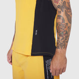 Laser-Vent Singlet Tank in amber and black, worn by model showing side view