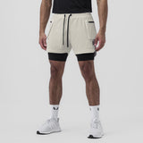 Tetra-Lite Liner Cargo Short in stone worn with black undershorts, front view on model