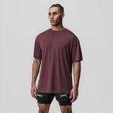 AeroSilver Oversized Tee in plum worn with black shorts, front view