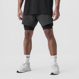 Tetra-Lite 7" Liner Short in Raven and Black, worn with white sneakers and socks, front view