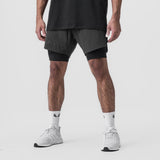 Tetra-Lite 7" Liner Short in Space Grey and Black, modeled from waist down with white sneakers