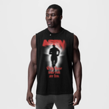Black Tech Essential Relaxed Cutoff tank top with 'Ghost Trace' graphic, front view on model