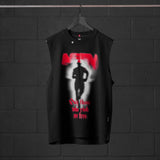 Black Tech Essential Relaxed Cutoff sleeveless shirt with red graphic print, displayed on hanger