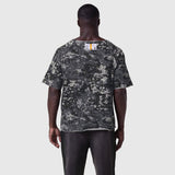 Vintage Raw Hem Pump Cover in pixel camo, worn by model facing away, back view