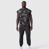 Tech Essential Cap Shoulder Cutoff in Pixel Camo worn with black joggers, front view