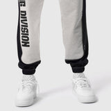 Tech-Terry Mesh Panel Sweats in heather grey and black worn with white sneakers, lower body view