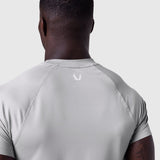AeroSilver Established Tee in slate grey worn by model, back view showing logo