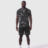 Supima Essential Tee in pixel camo worn with black shorts, front view on model