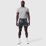 Tetra-Lite Liner Short in pixel camo, worn by model standing facing camera