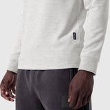 Waffle knit longsleeve in heather grey worn with dark shorts, side view