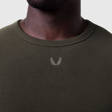 Olive waffle knit longsleeve on model, front view showing chest logo detail