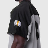 Ion-Mesh Crop Jersey in slate grey and black colorblock, worn by model showing back and side view