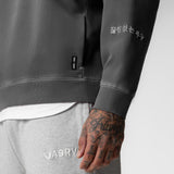 Tech Essential Distressed Crewneck in faded grey worn by model, close-up detail shot