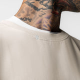 Tech Essential Distressed Crewneck in Faded Stone worn by model, neckline detail