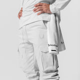 Tech-Terry Cargo High Rib Jogger in white, worn by model showing side view and cargo pockets