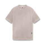 flatlay Tech Essential Relaxed Tee in faded chai, front view