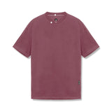 flatlay Tech Essential Relaxed Tee in faded crimson, front view