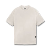 flatlay Tech Essential Relaxed Tee in faded stone, front view