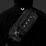 0703 Cordura Tech Crossbody Pack in Black Grid, worn on model's back