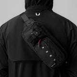 0703 Cordura Tech Crossbody Pack in black grid, worn across back
