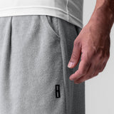 Towel Terry Relaxed Short in heather grey, worn by model with hand in pocket detail