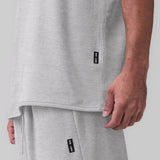 Towel Terry Cutoff in heather grey worn by model, side detail view showing fit