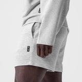 Waffle Knit Sweat Short in Heather Grey, worn with hand in pocket, side view