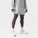 Heather grey waffle knit sweat shorts worn with matching hoodie, front view on model