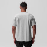 Tech Essential Relaxed Tee in heather grey, back view on model