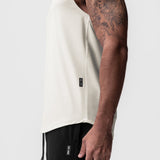 AeroSilver Cutoff Tank in ivory cream worn by model, side view showing fit